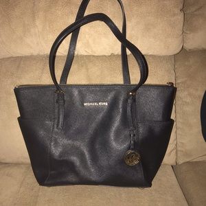 Michaels Kors black and gold purse